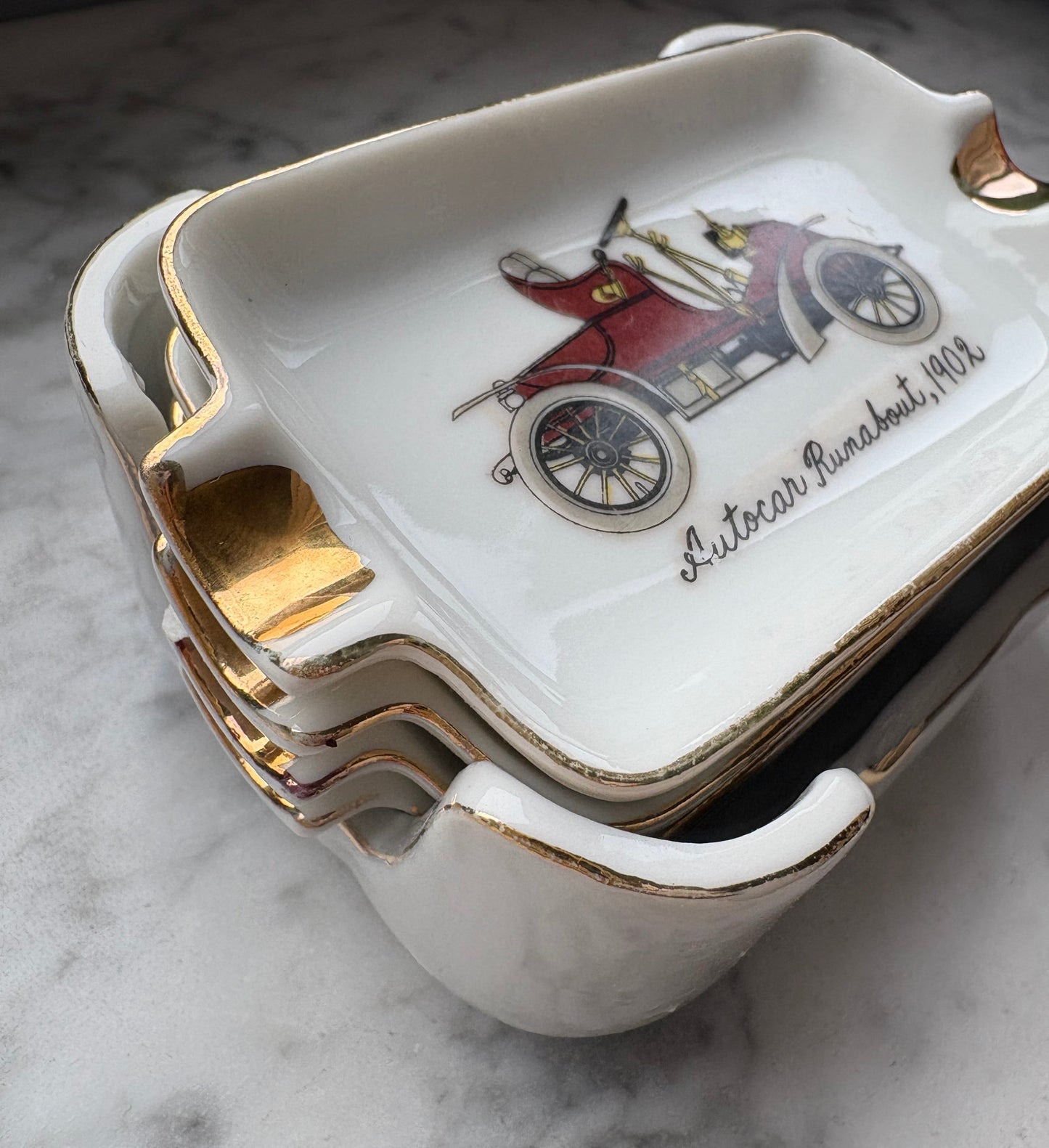 Mid-Century Porcelain Automobile Ashtray Set – 5 Pieces Gold Trim